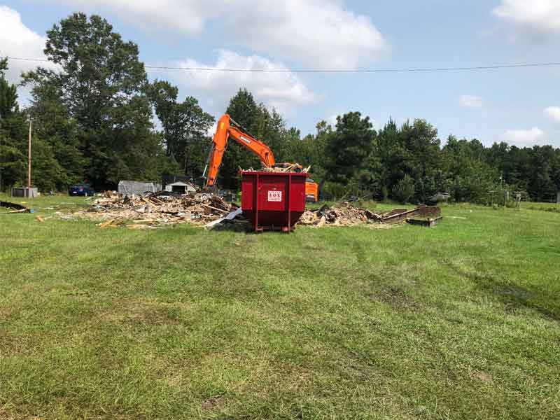 Cleaning up backyard mess with a dump trailer